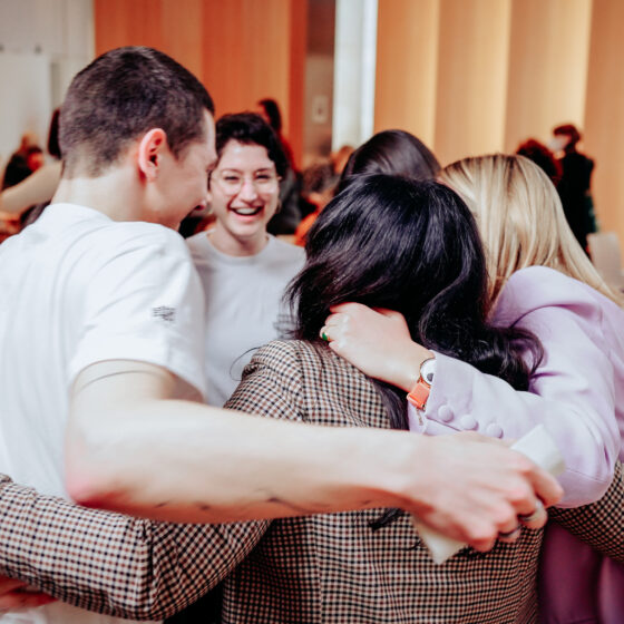 A group of people in a group hug